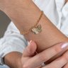 Pulseira Com Pingente De Borboleta Cravejado Em Zircônias Banhado A Ouro E1185 Pulseira Com Pingente De Borboleta Cravejado Em Zircônias Banhado A Ouro E1185
