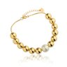 01 pulseira de esferas com perola central banhada a ouro